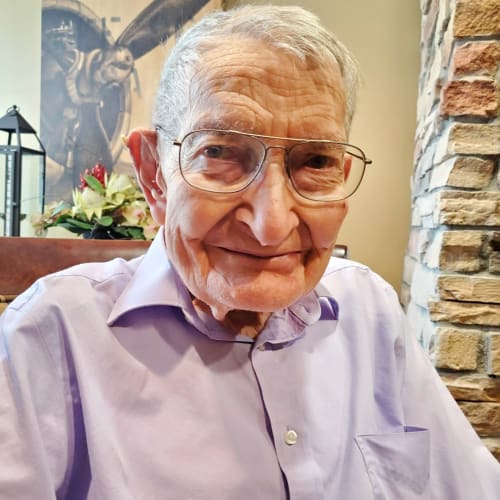 A resident relaxing in the lounge at The Oxford Grand Assisted Living & Memory Care in Wichita, Kansas