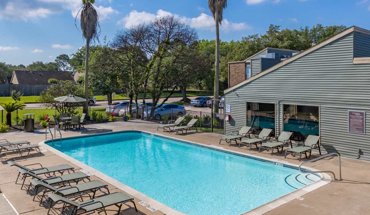 Inviting pool with resident lounge area at University Green Apartments in Houston, Texas