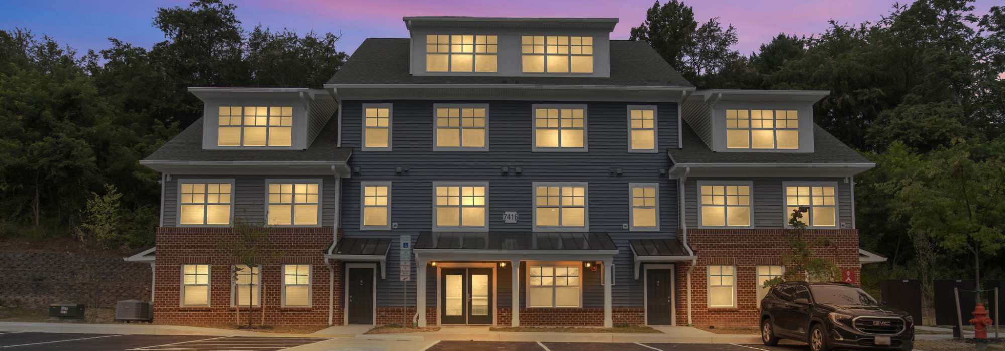 Exterior rendering of building at night at Robinson Overlook in Columbia, Maryland