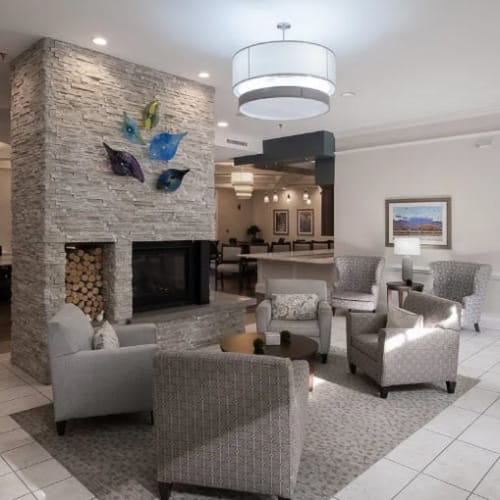 Lobby area with plush chairs and fireplace at Bartlett Reserve in Durham, North Carolina