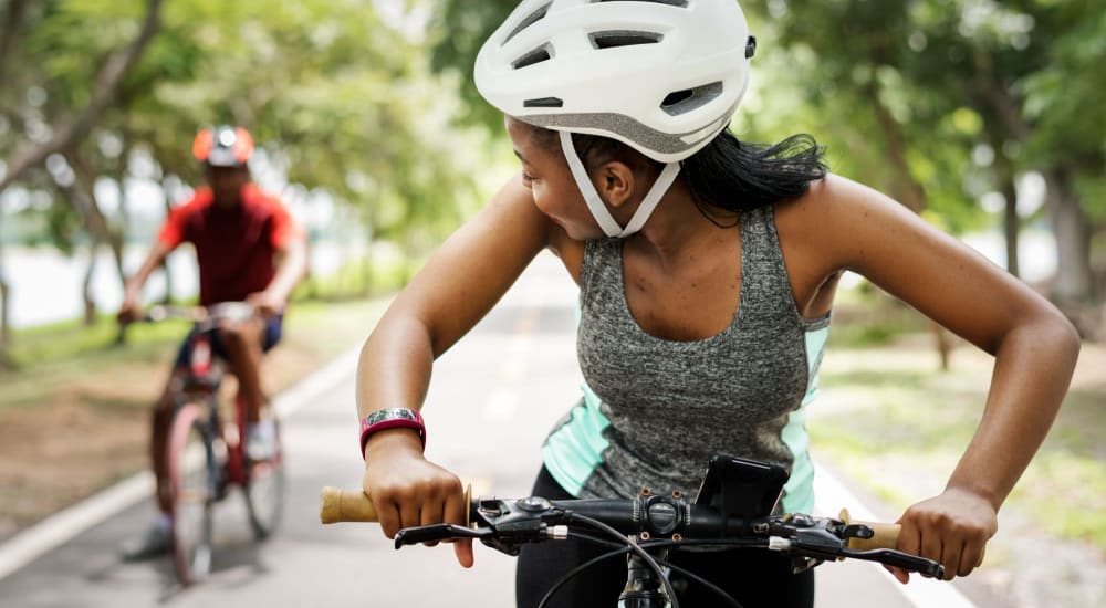 Residents ride bikes in a park near LaCabreah in Brownsburg, Indiana