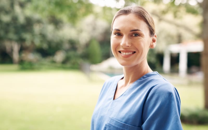 Caring nurse on her way in to work at Grand Villa of Delray Beach East in Delray Beach, Florida