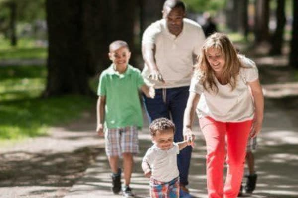 Family walking in Rochester, New York near Glenbrook Manor