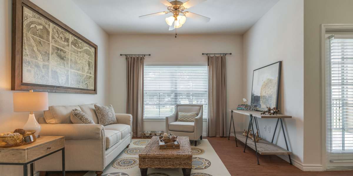 A cozy living room featuring a comfortable couch, a stylish coffee table at Edgewater at Klein in Spring, Texas