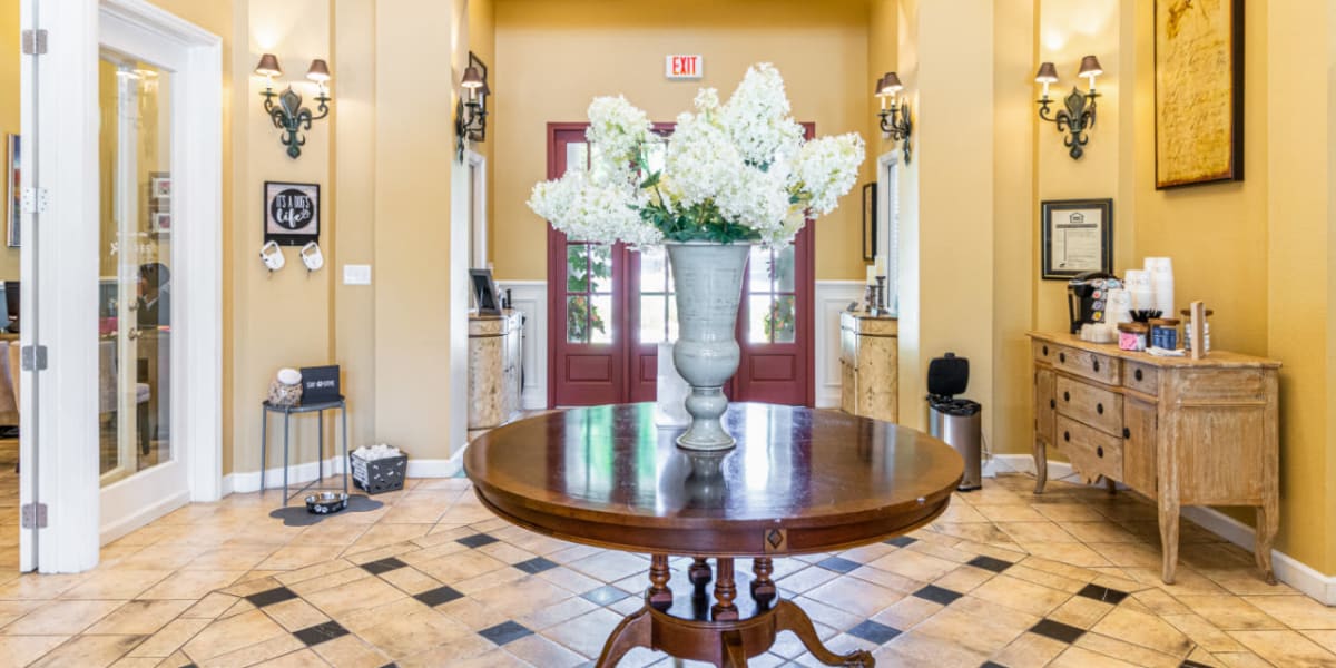 Lobby entrance with self-serve coffee area at Marquis of Carmel Valley in Charlotte, North Carolina