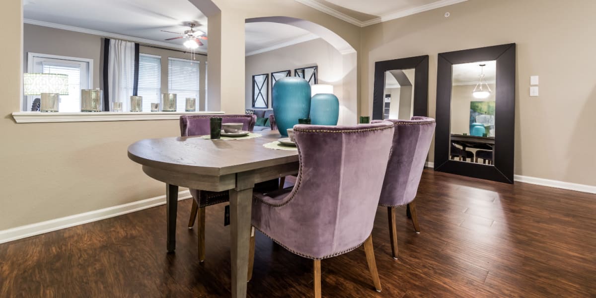 Large dining room with opening to living area at Marquis at The Cascades in Tyler, Texas
