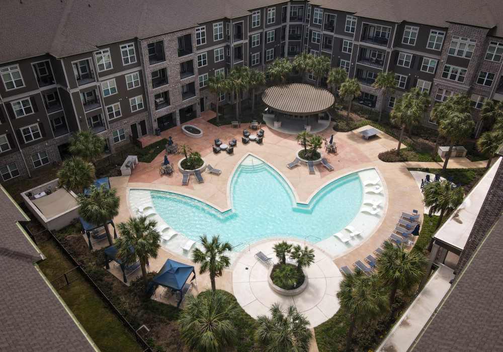 Aerial view of the community swimming pool at Orleans at Fannin Station in Houston, Texas