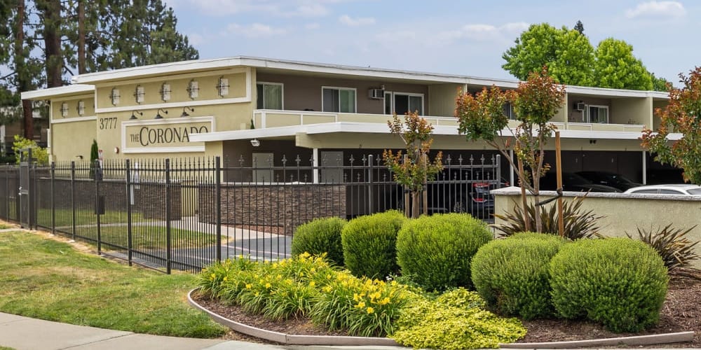 Front of community and gardens at Coronado Apartments in Fremont, California