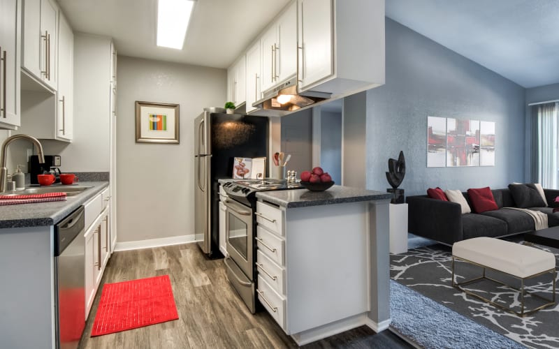 Renovated kitchen with white cabinets at Terra Nova Villas in Chula Vista, California