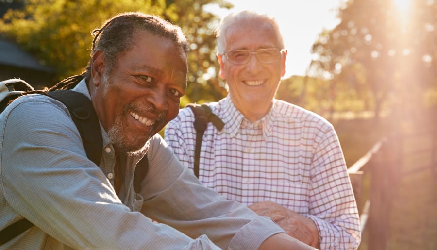 Two happy elderly residents outside at Touchmark Central Office in Beaverton, Oregon