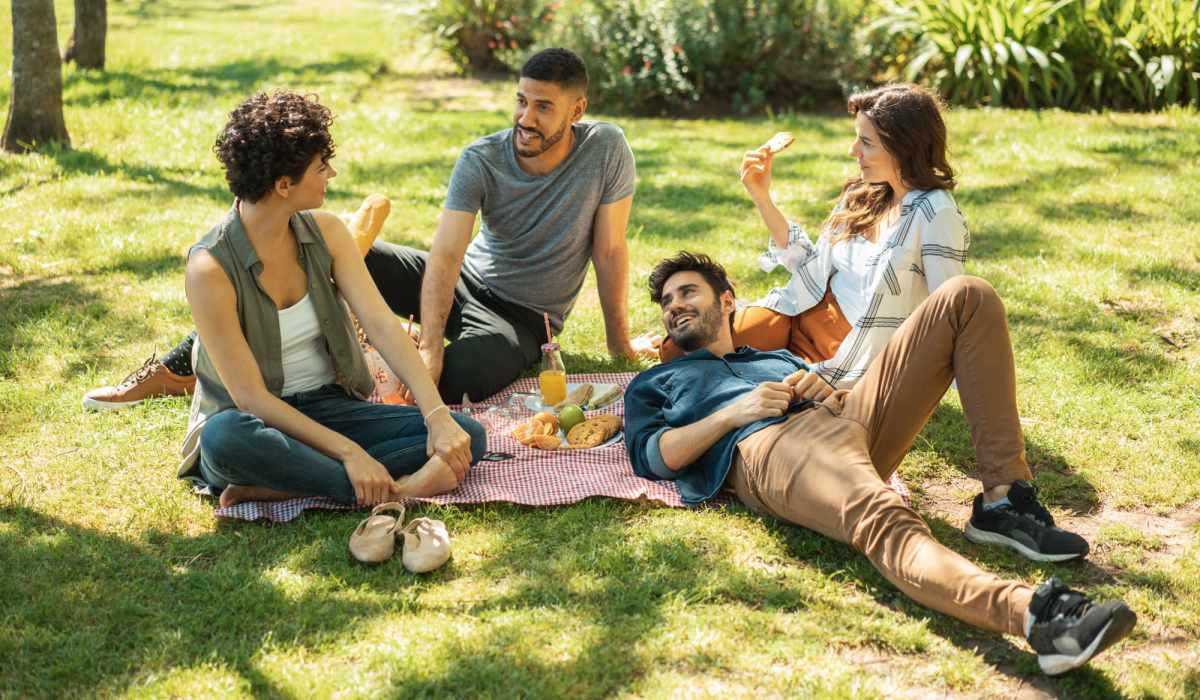 Group of friends enjoying a picnic in the park near Waterstone At Carrollwood in Tampa, Florida