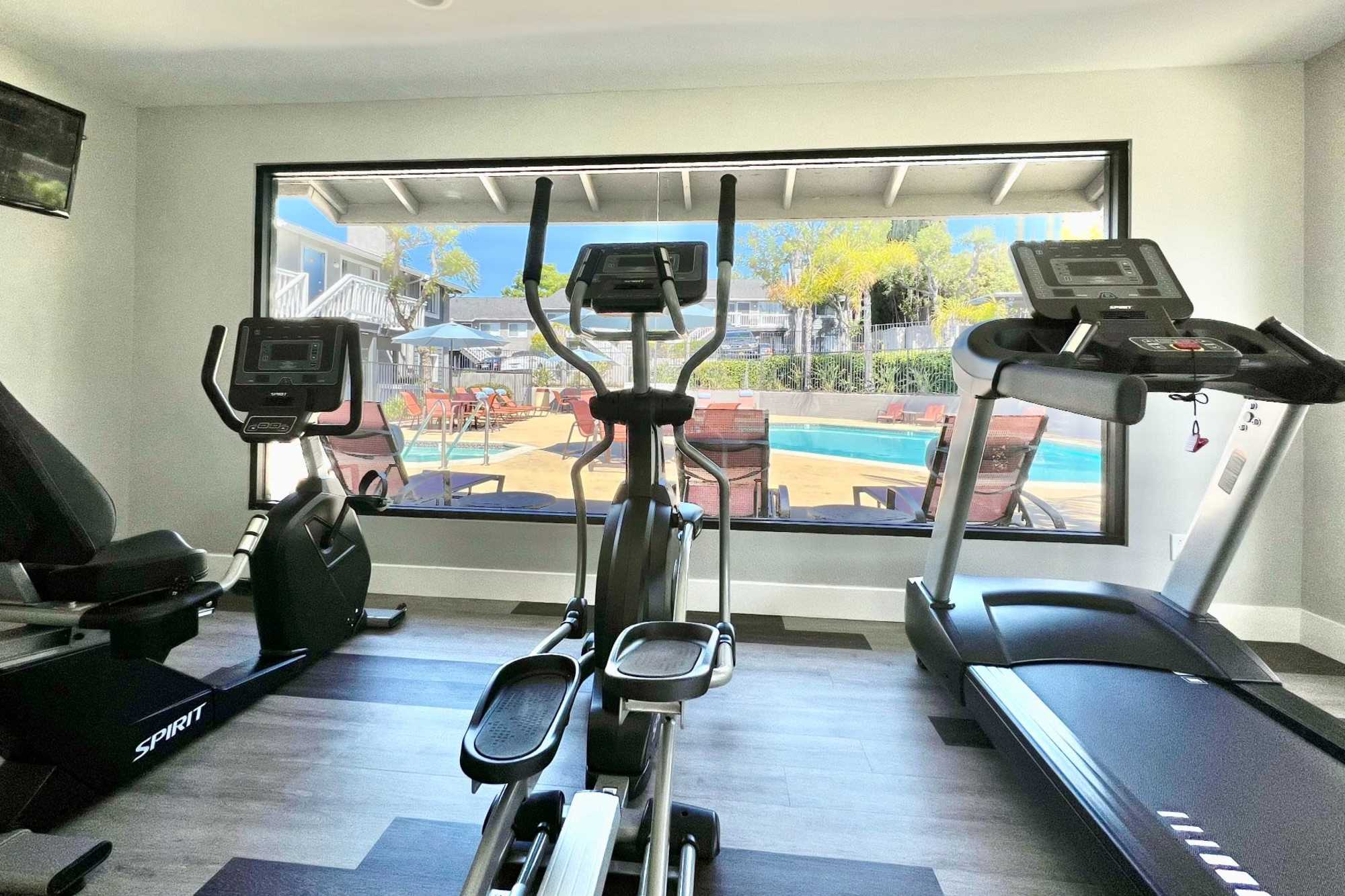 Fitness center with plenty of individual workout stations at Hillside Terrace Apartments in Lemon Grove, California