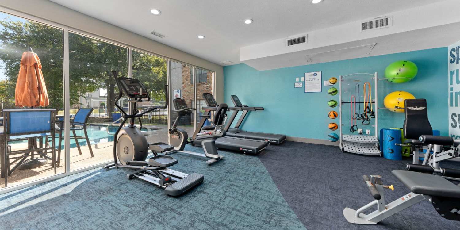 Modern fitness center at Ronan Apartment Homes in Grand Prairie, Texas