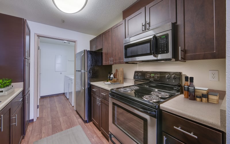 Renovated kitchen with stainless steel appliances at Renaissance at 29th Apartments in Vancouver, Washington