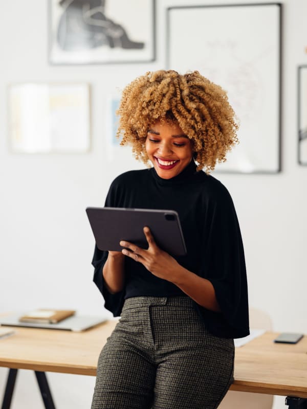 Team member looking at a tablet at Symphony Property Management in Buffalo, New York