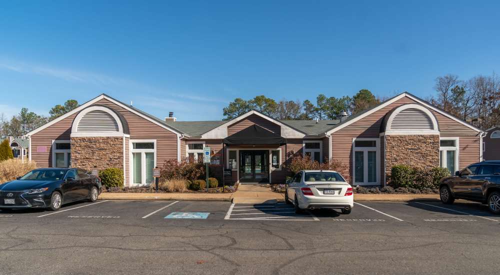Leasing office exterior with parking spaces at Reserve South in Richmond, Virginia