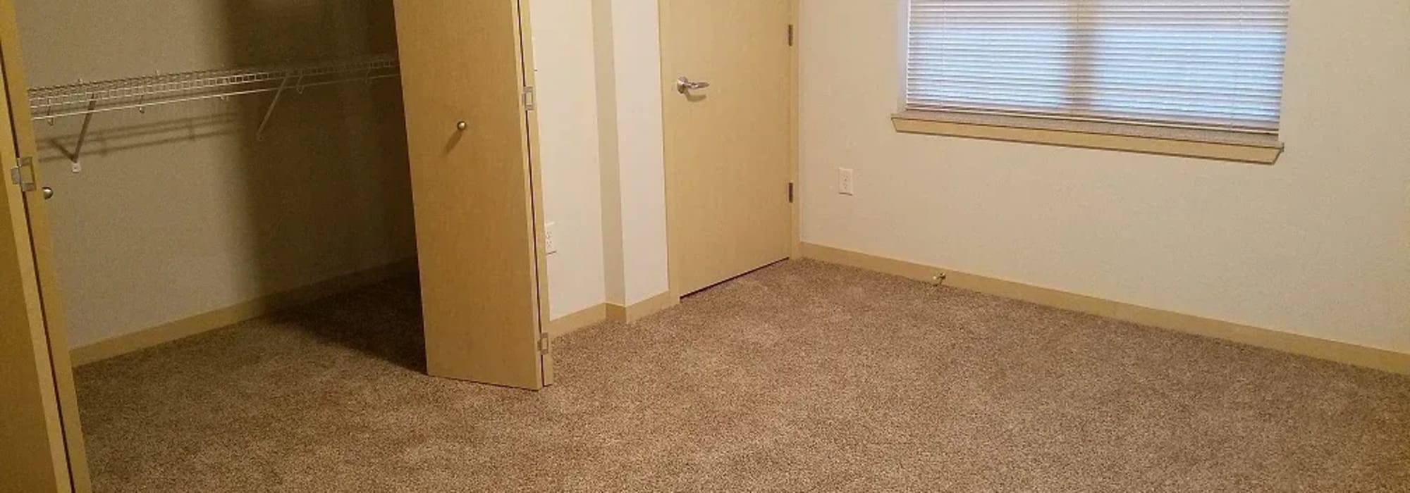  Bedroom with walk-in closets at Mill Creek Apartments in Cross Plains, Wisconsin