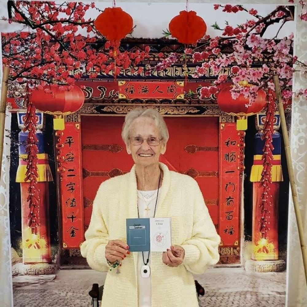 A resident posing for a picture at Inspired Living Lakewood Ranch in Bradenton, Florida.