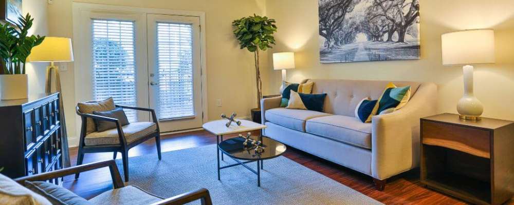 Well-furnished apartment living area at Arbors at Fort Mill in Fort Mill, South Carolina