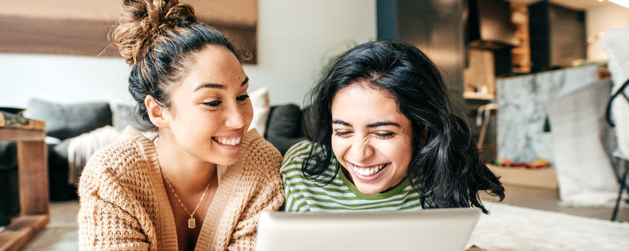 Two residents looking at a tablet at Arborgate Apartments Homes in Charlotte, North Carolina