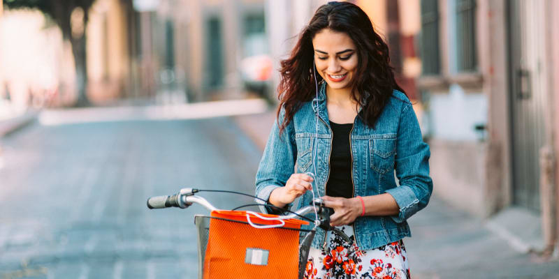 A resindet with her bike shopping near South Mesa I in Oceanside, California