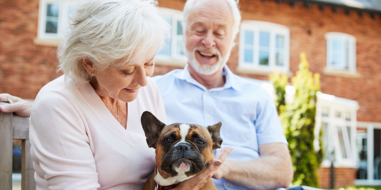 Residents and their dog at a Merrill Gardens community.