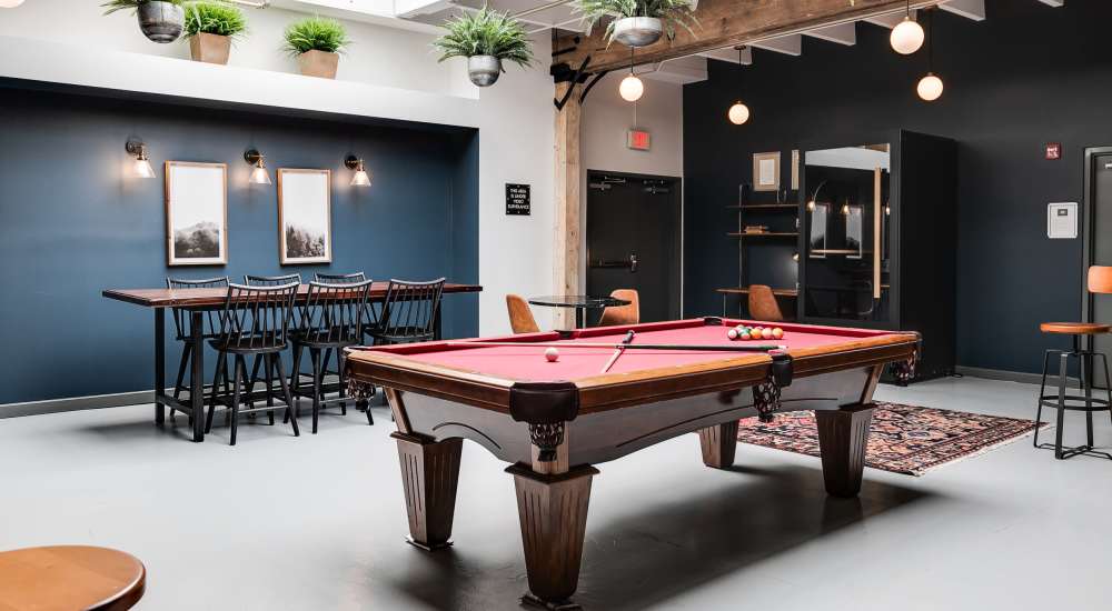 Community playroom with pool table at Hopper Lofts in Richmond, Virginia