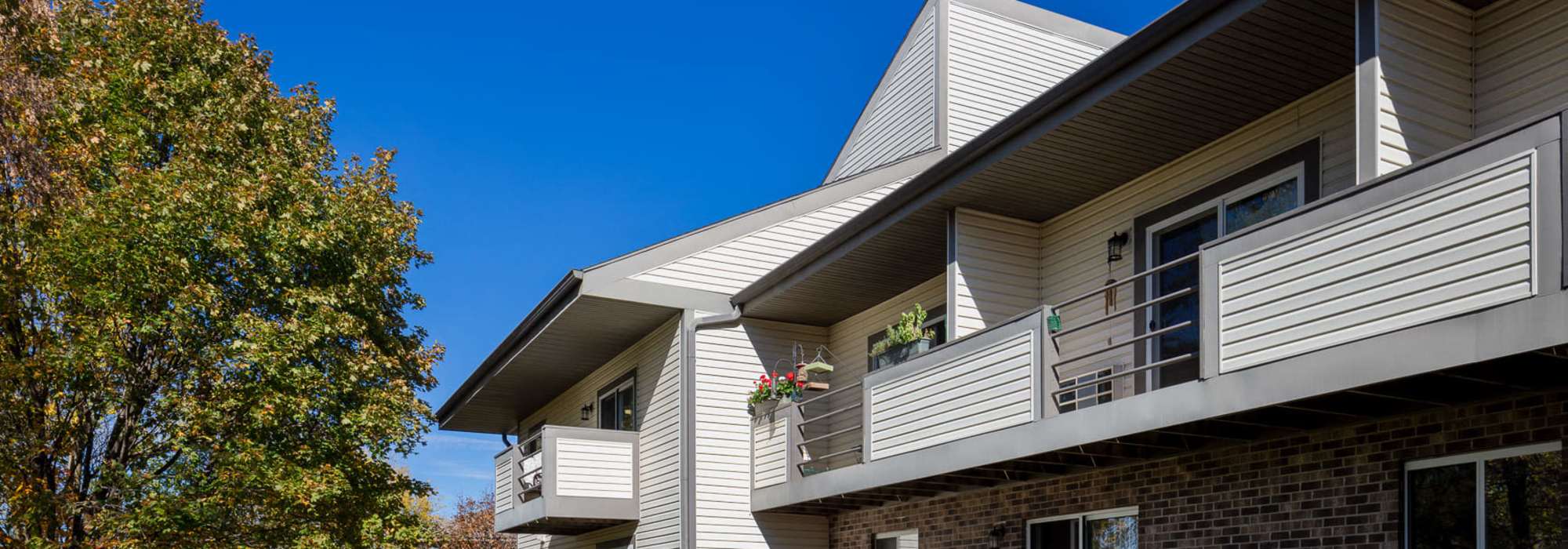 Community apartment with private balcony at Pine Cove Apartments in Oregon, Wisconsin