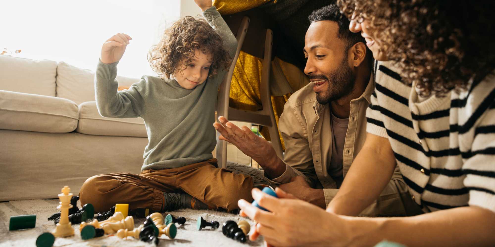 Hapyy family playinng chesss at Hart Townes in Woodruff, 