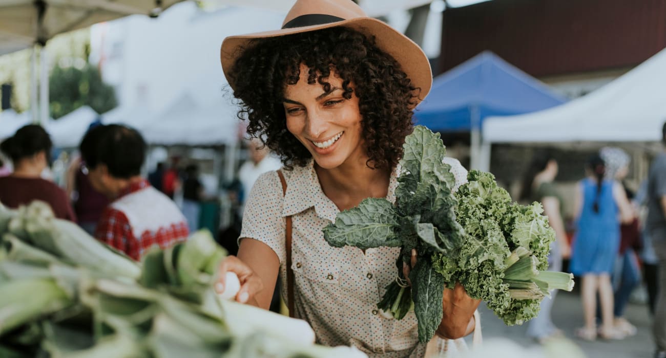 Resident shopping at a local farmers market in West Orange, New Jersey near Northfield Townhouses