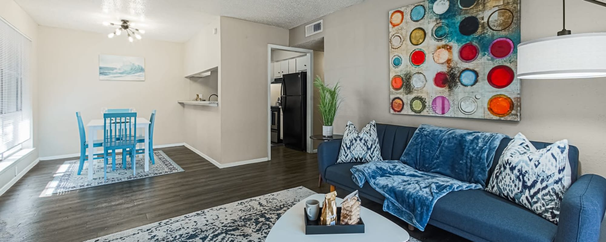 Apartment living room and dining area at Retreat at 2818 in Bryan, Texas