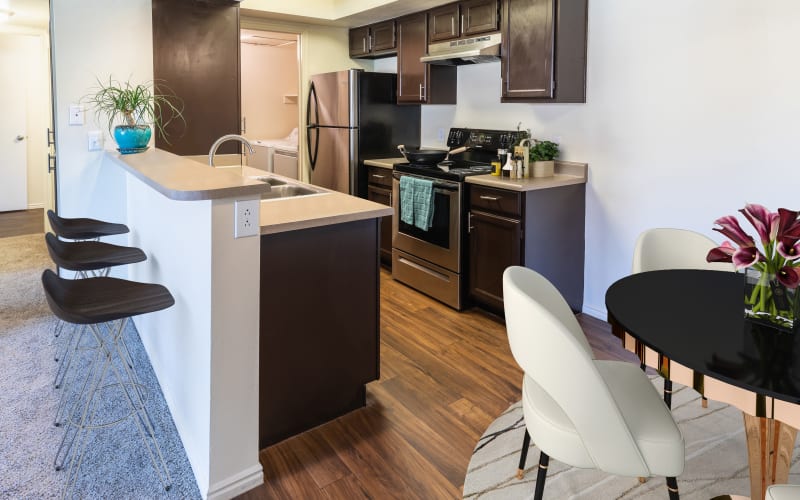 Fully equipped kitchen with stainless steel appliances at Shadowbrook Apartments in West Valley City, Utah