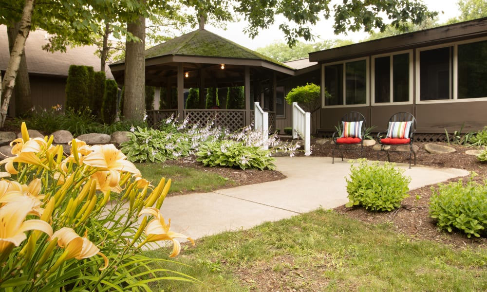 Paved path leading to a gazebo at Lakeshore Woods in Fort Gratiot, Michigan