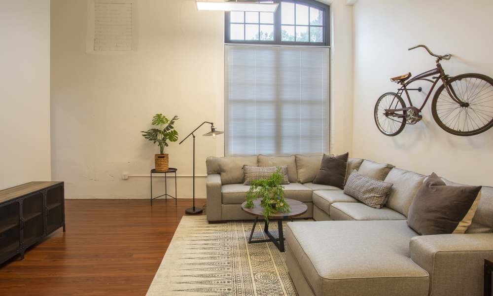 Living room with sophisticated furnishings at Lofts at Inman Mills in Inman, South Carolina