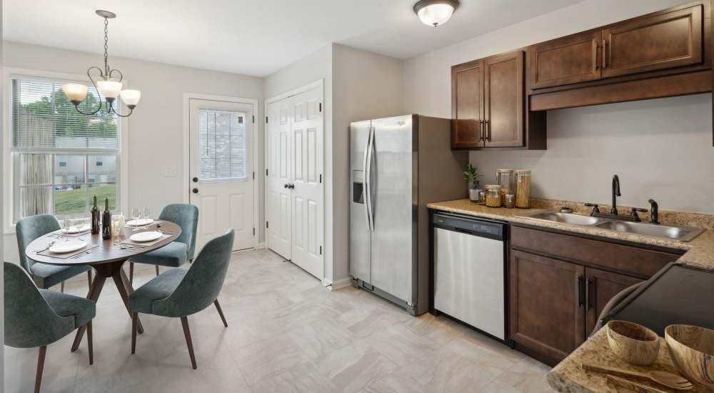 Kitchen with wood style flooring at Northpark Commons in Clarksville, Tennessee   