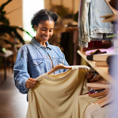 Resident shopping at a boutique near The Mallory in Raleigh, North Carolina