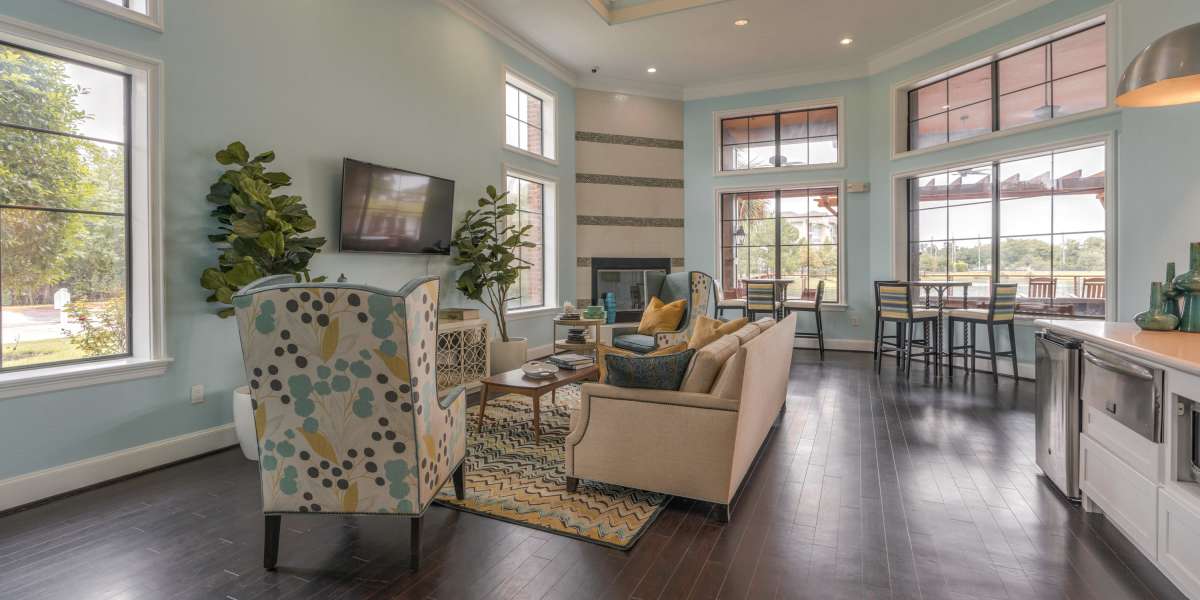 Stylish community clubhouse with a lounge area and dining spaces at Edgewater at Klein in Spring, Texas