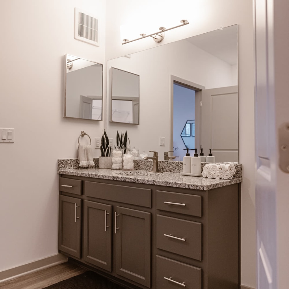 Bathroom mirror and drawers at Center West Apartments in Midlothian, Virginia