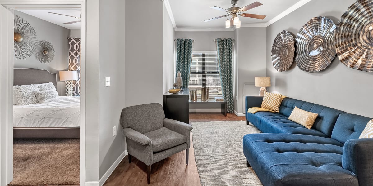 Living room and bedroom at Marquis at Texas Street in Dallas, Texas