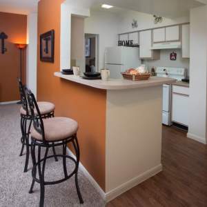 Kitchen with breakfast bar at Las Palmas Apartments in Brownsville, Texas