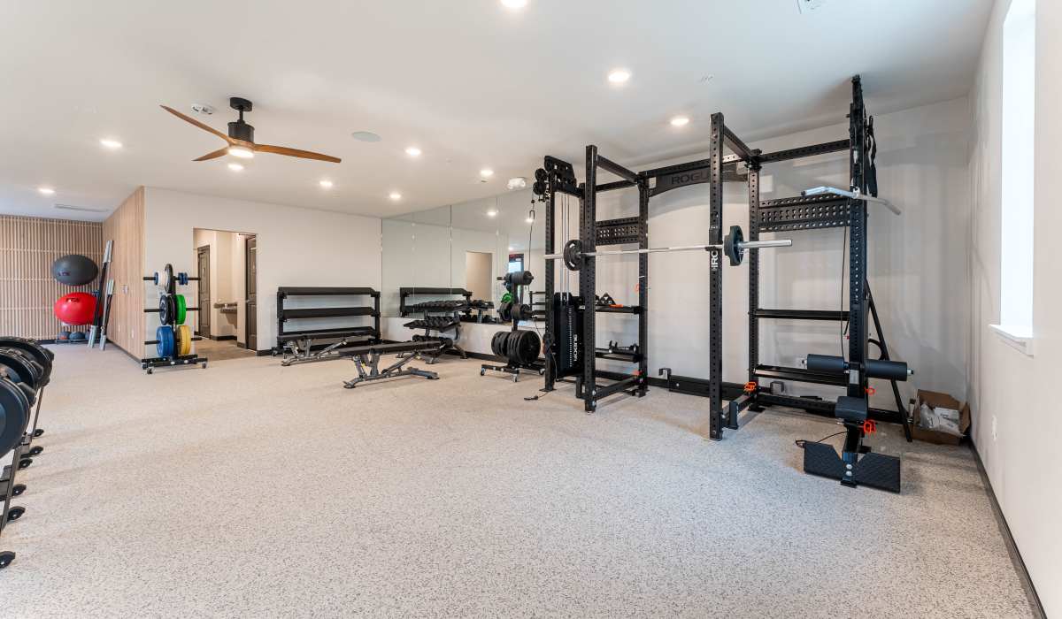 Well equipped fitness center at Pure Lowell Apartments in Lowell, Arkansas