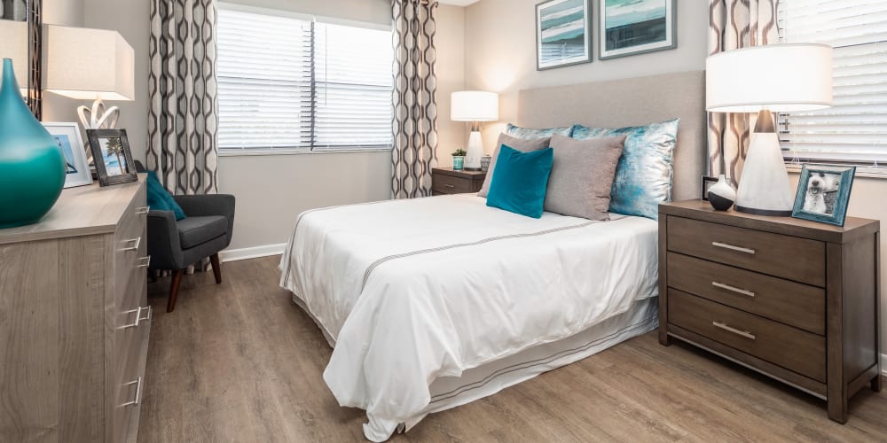 Well lit bedroom with tons of open space and wood style flooring at The EnV in Hollywood, Florida
