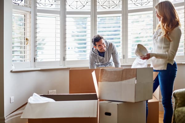 A couple packing with boxes from Downtown Self Storage - Johnson Street in Portland, Oregon