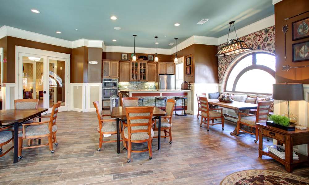Charming communal dining area with a modern kitchen and elegant decor at Avonlea Square in Smyrna, Georgia.