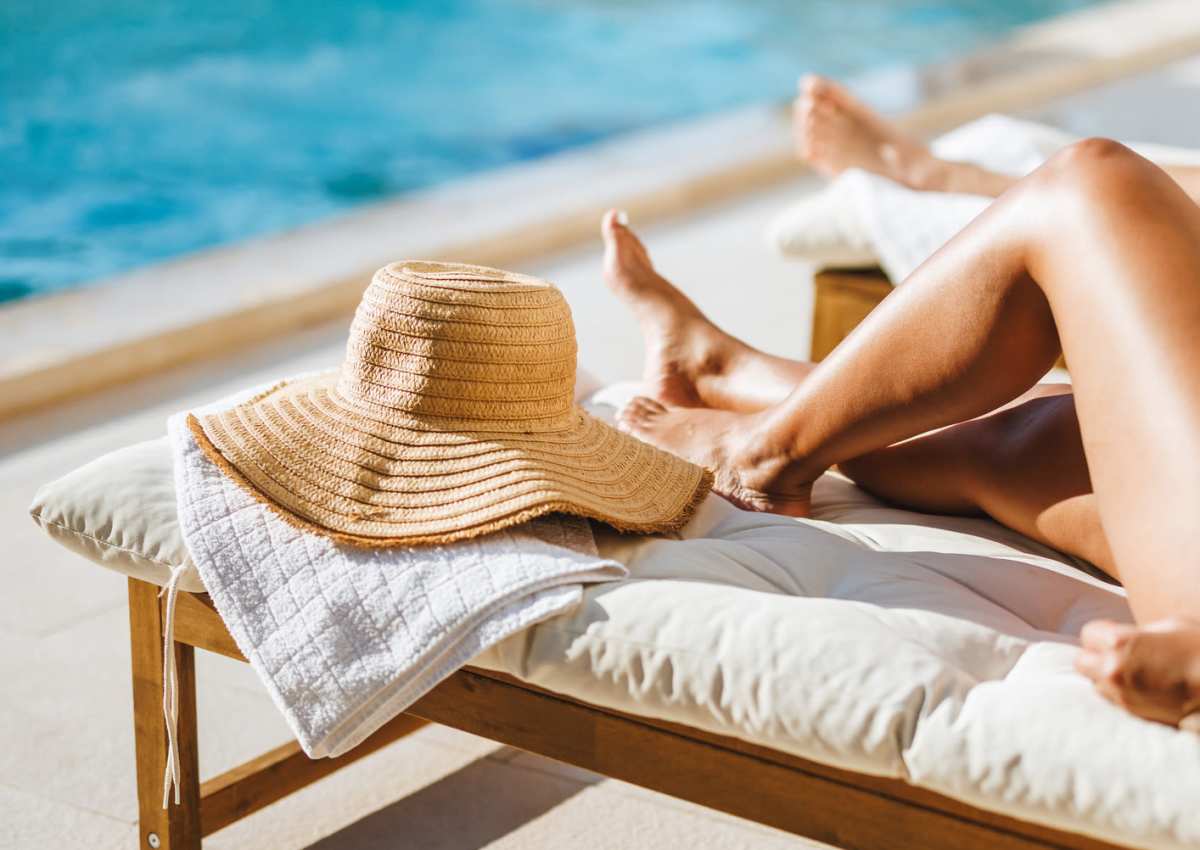 Resident relaxing by the pool at Stone Village Apartments in Reno, Nevada