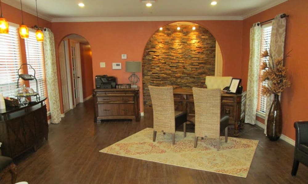 A desk and chairs in the leasing office at The Granite at Tuscany Hills in San Antonio, Texas