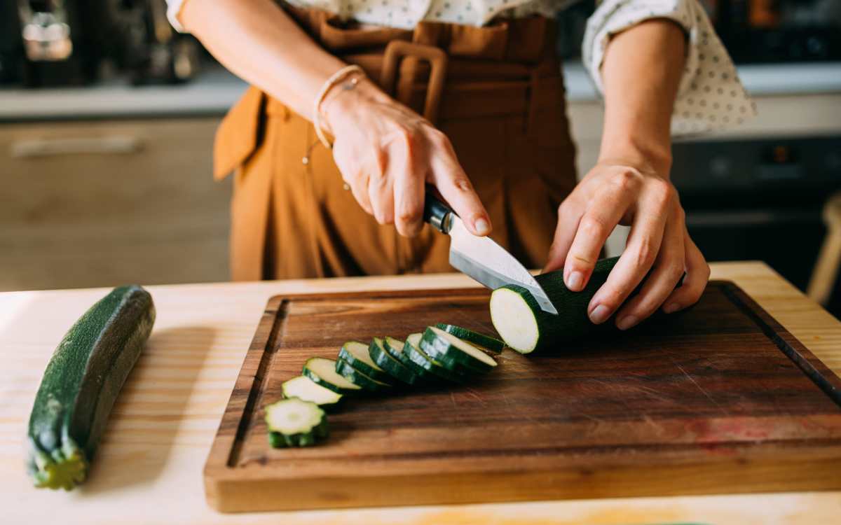 Resident chopping vegetables at Stone Village Apartments in Reno, Nevada
