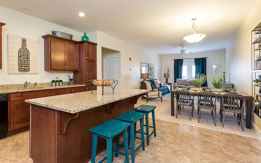 Kitchen and dining area in a home at Gateway Landing on the Canal in Rochester, New York