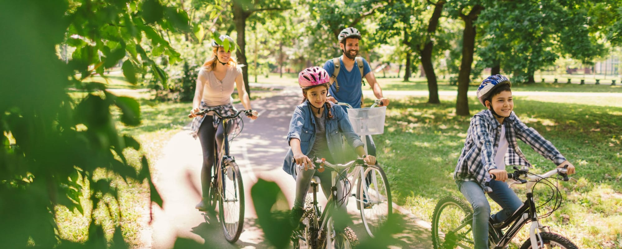 Residents ride through the park near The Linc at Cypress in Houston, Texas