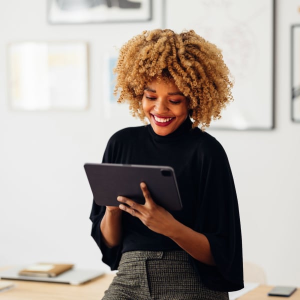 Team member holding iPad at Symphony Property Management in Buffalo, New York